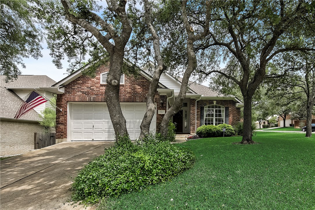 2860 Grimes Ranch Road Austin, TX 78732 - Photo 1 of 1 front view of a house with a yard