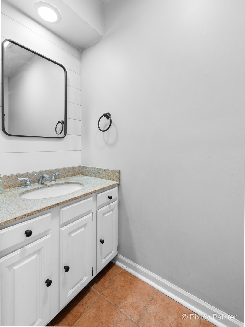 3134 Chellington Drive Johnsburg, IL 60051 - Photo 21 of 41 a bathroom with a sink and a mirror