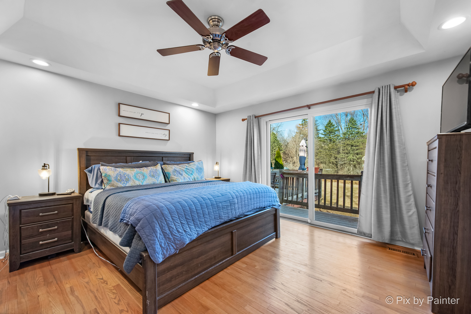 3134 Chellington Drive Johnsburg, IL 60051 - Photo 22 of 41 a bedroom with a large bed and a tv