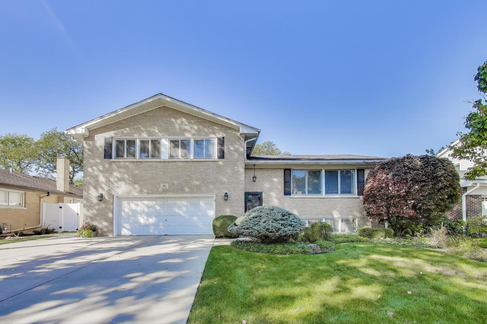 804 Euclid Avenue Elmhurst, IL 60126 - Photo 1 of 28 a front view of a house with a yard