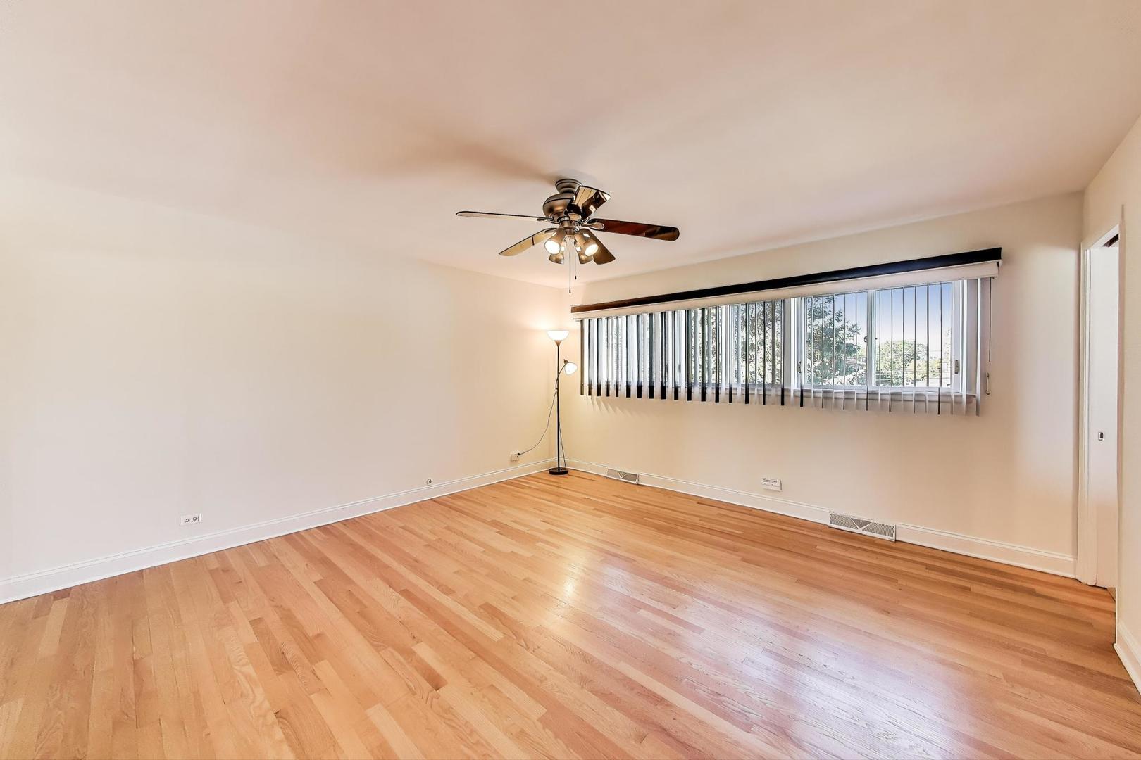 804 Euclid Avenue Elmhurst, IL 60126 - Photo 11 of 28 wooden floor in an empty room with a window