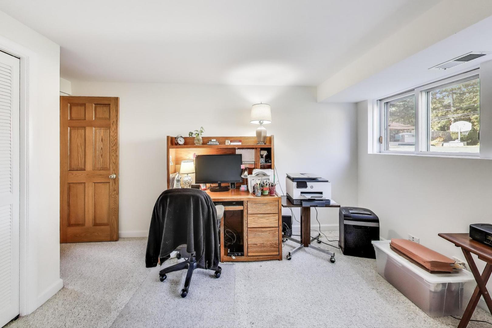 804 Euclid Avenue Elmhurst, IL 60126 - Photo 18 of 28 a view of a workspace with furniture and a window