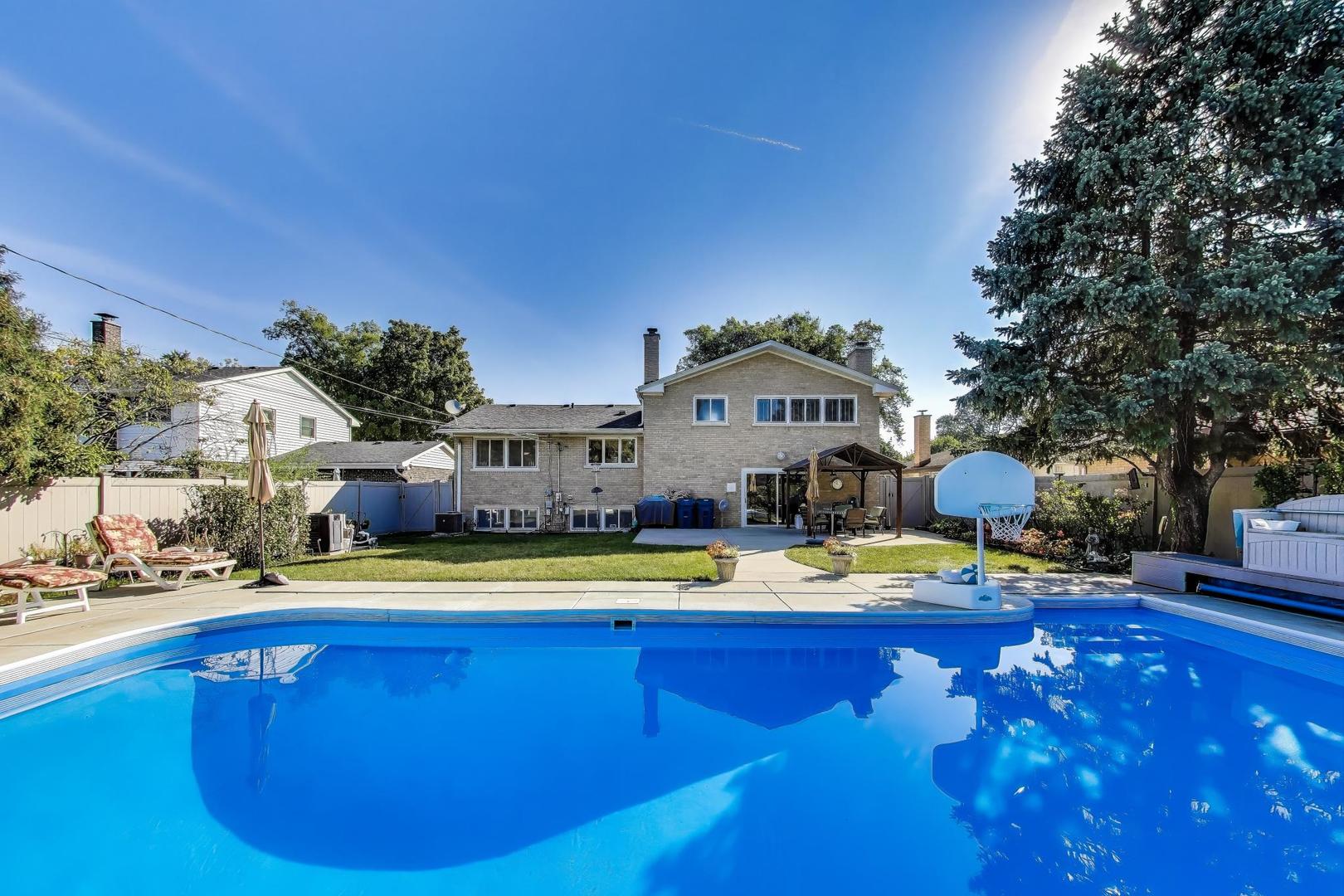 804 Euclid Avenue Elmhurst, IL 60126 - Photo 2 of 28 a view of a swimming pool with an outdoor space and seating area