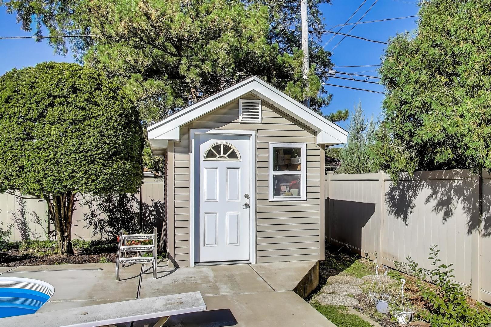 804 Euclid Avenue Elmhurst, IL 60126 - Photo 25 of 28 a front view of a house with a yard and garage
