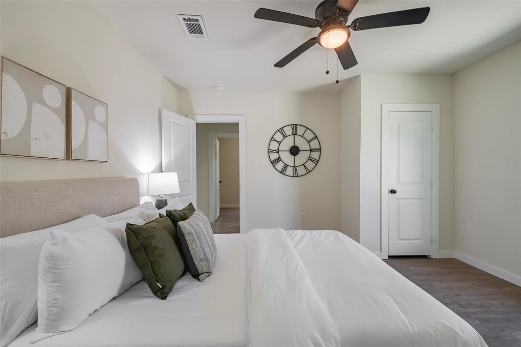 1101 Anthony Street McKinney, TX 75069 - Photo 18 of 26 a bedroom with a bed and painting on the wall