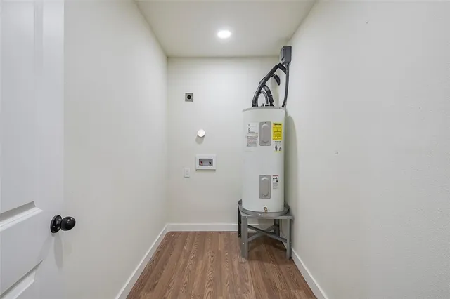 a view of hallway with wooden floor