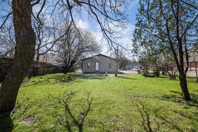 a house view with swimming pool