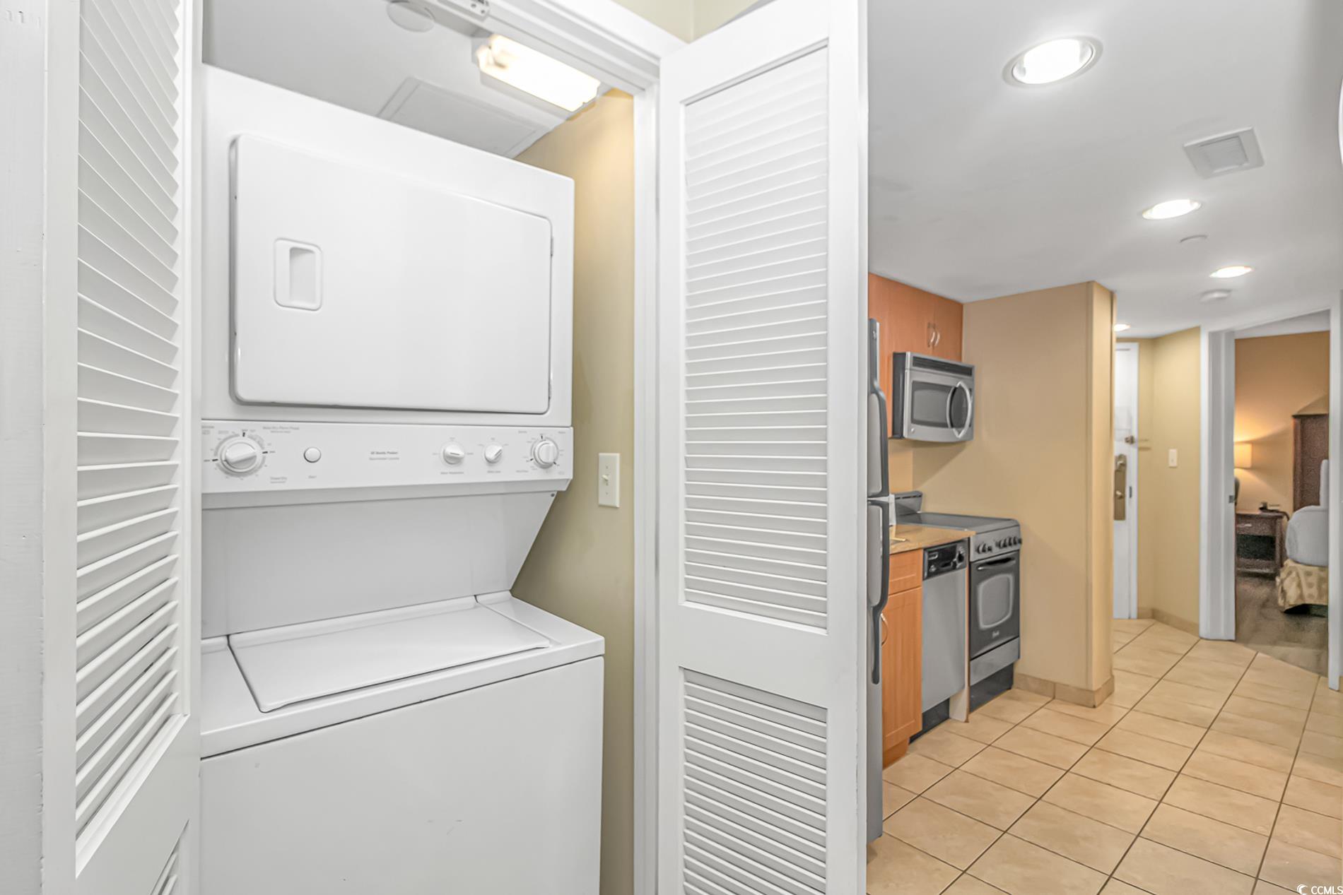 201 South Ocean Boulevard, Unit 1905 Myrtle Beach, SC 29577 - Photo 22 of 32 Washroom with stacked washer and clothes dryer, recessed lighting, and light tile patterned flooring
