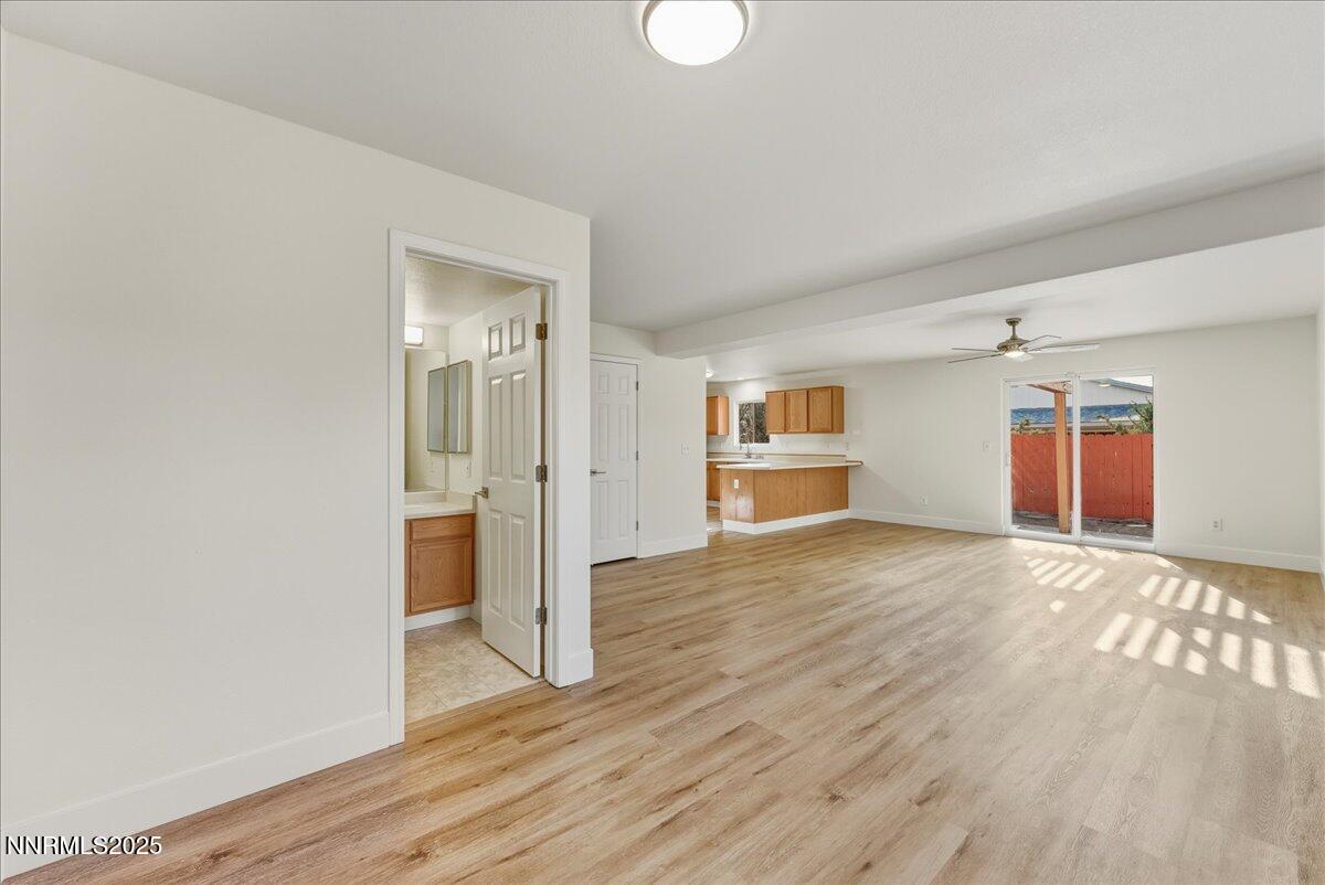 17598 Elk Court Reno, NV 89508 - Photo 19 of 43 a view of empty room with wooden floor