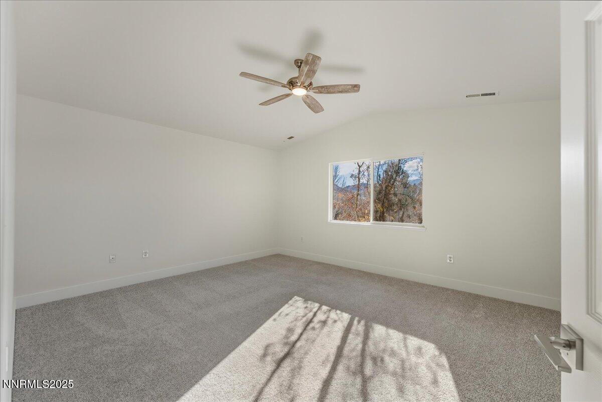 17598 Elk Court Reno, NV 89508 - Photo 21 of 43 an empty room with windows and fan