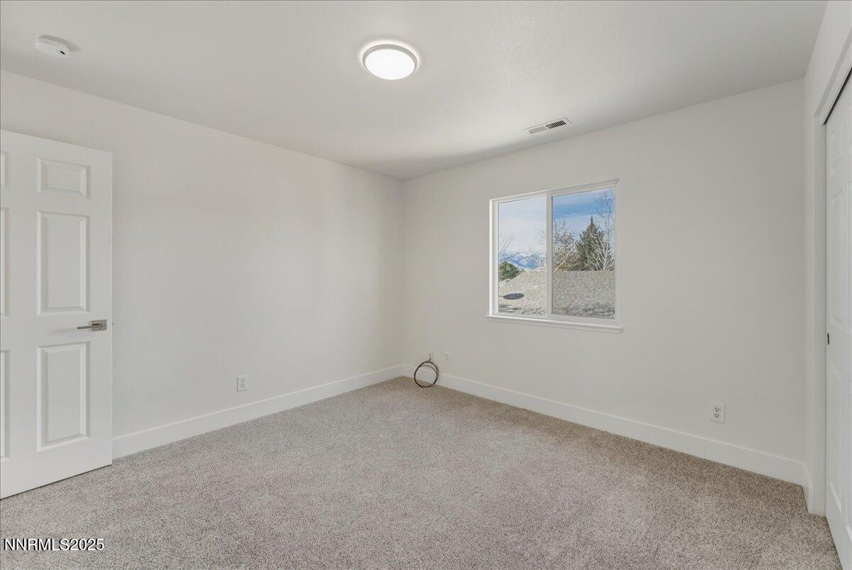 17598 Elk Court Reno, NV 89508 - Photo 28 of 43 an empty room with a workbench