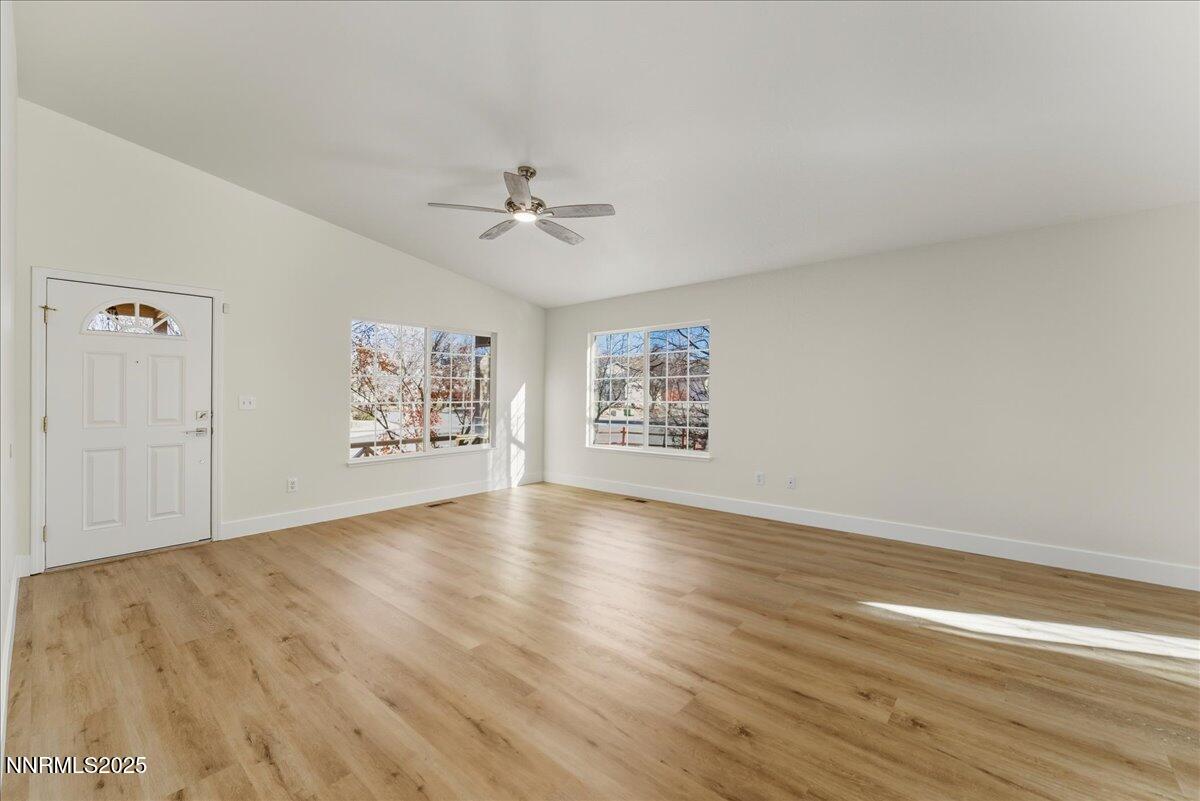 17598 Elk Court Reno, NV 89508 - Photo 7 of 43 a view of empty room with wooden floor and fan