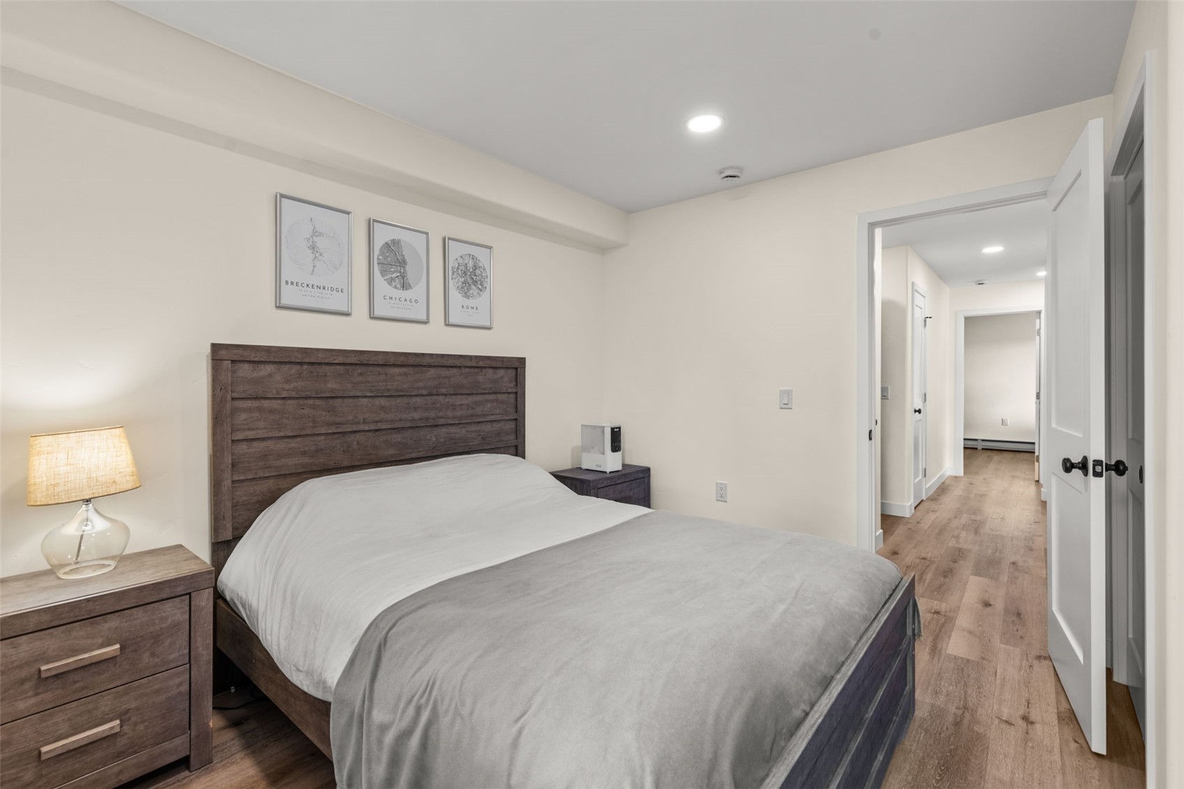 1127 Ski Hill Road, Unit 104 Breckenridge, CO 80424 - Photo 21 of 32 a bedroom with a bed and a lamp