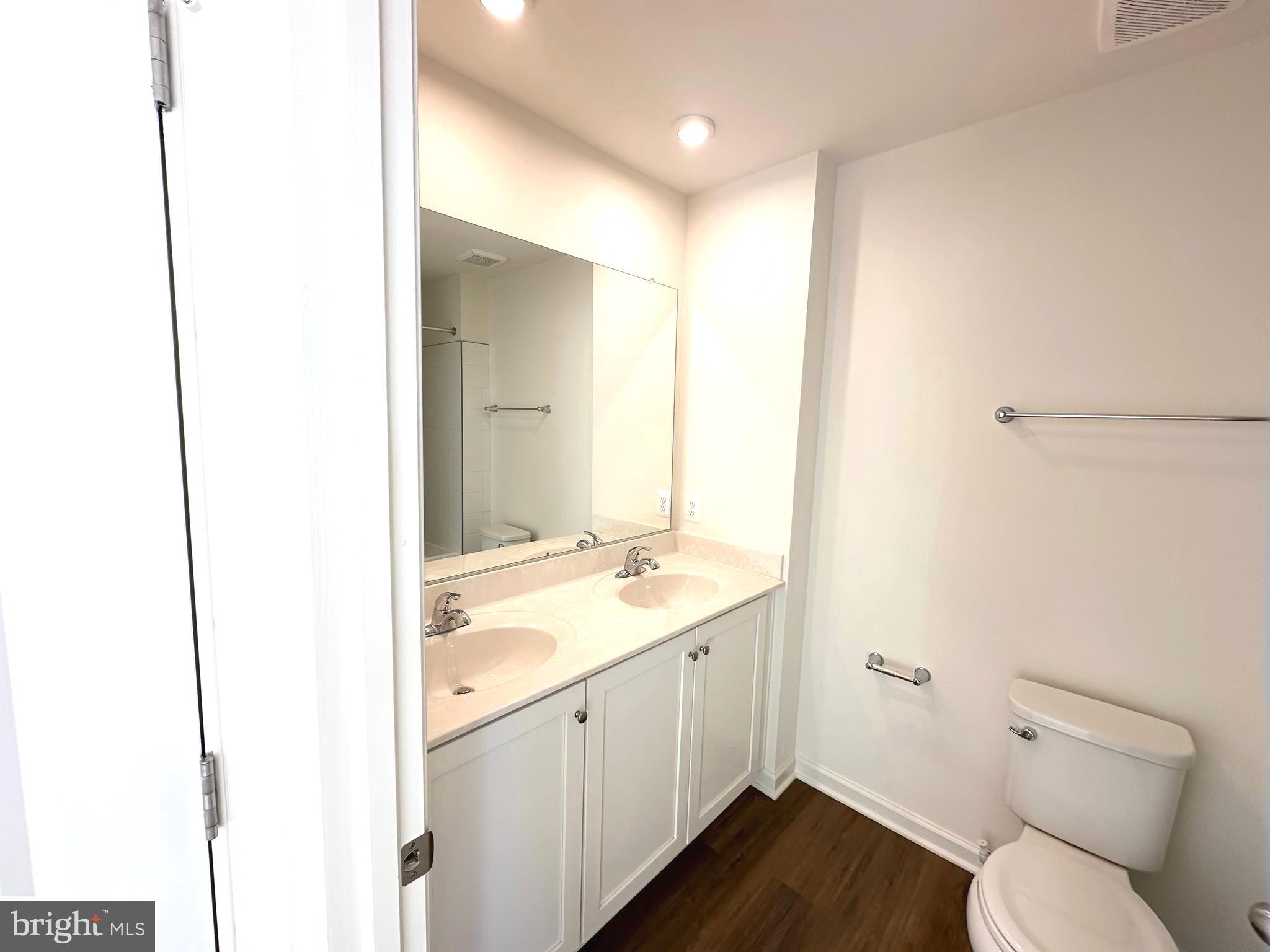 171 Homestead Drive Hanover, PA 17331 - Photo 22 of 34 a bathroom with a granite countertop sink a toilet and a mirror