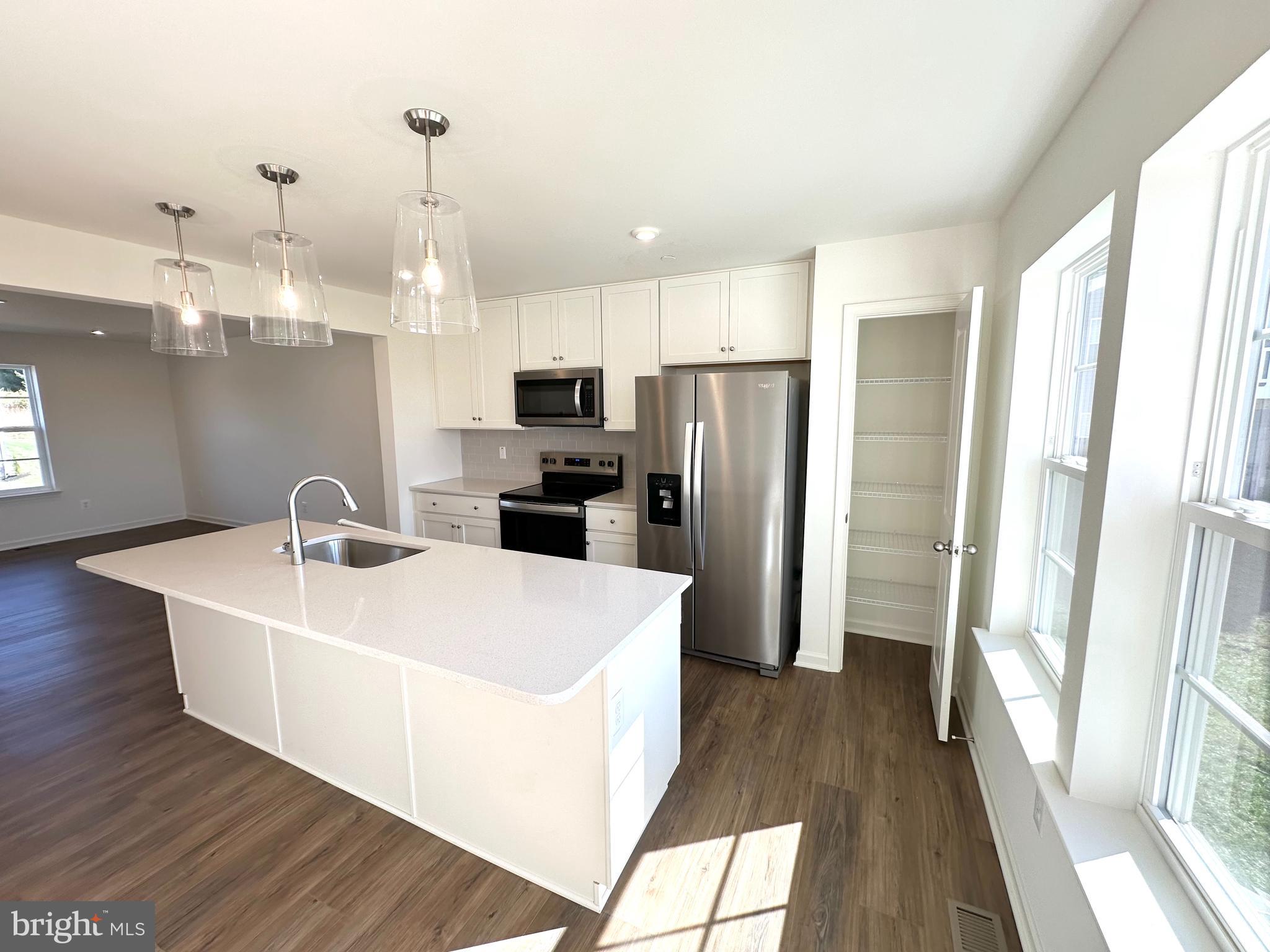 171 Homestead Drive Hanover, PA 17331 - Photo 4 of 34 a white kitchen with sink a refrigerator and dishwasher