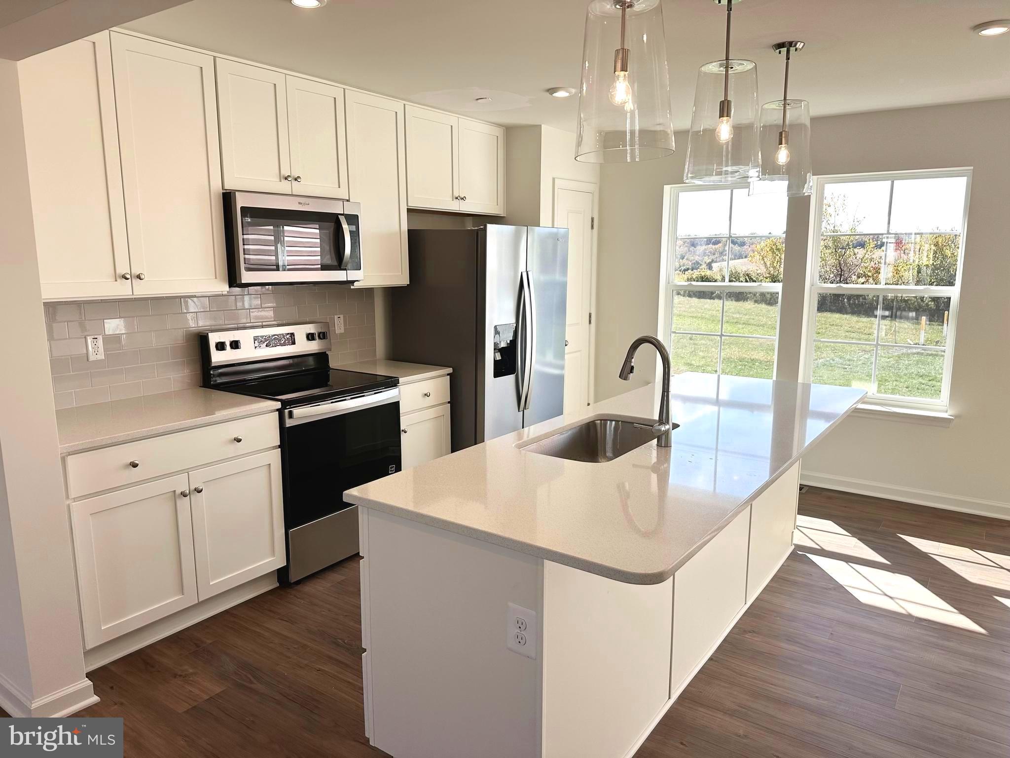 171 Homestead Drive Hanover, PA 17331 - Photo 6 of 34 a kitchen with stainless steel appliances granite countertop a sink a stove and a refrigerator