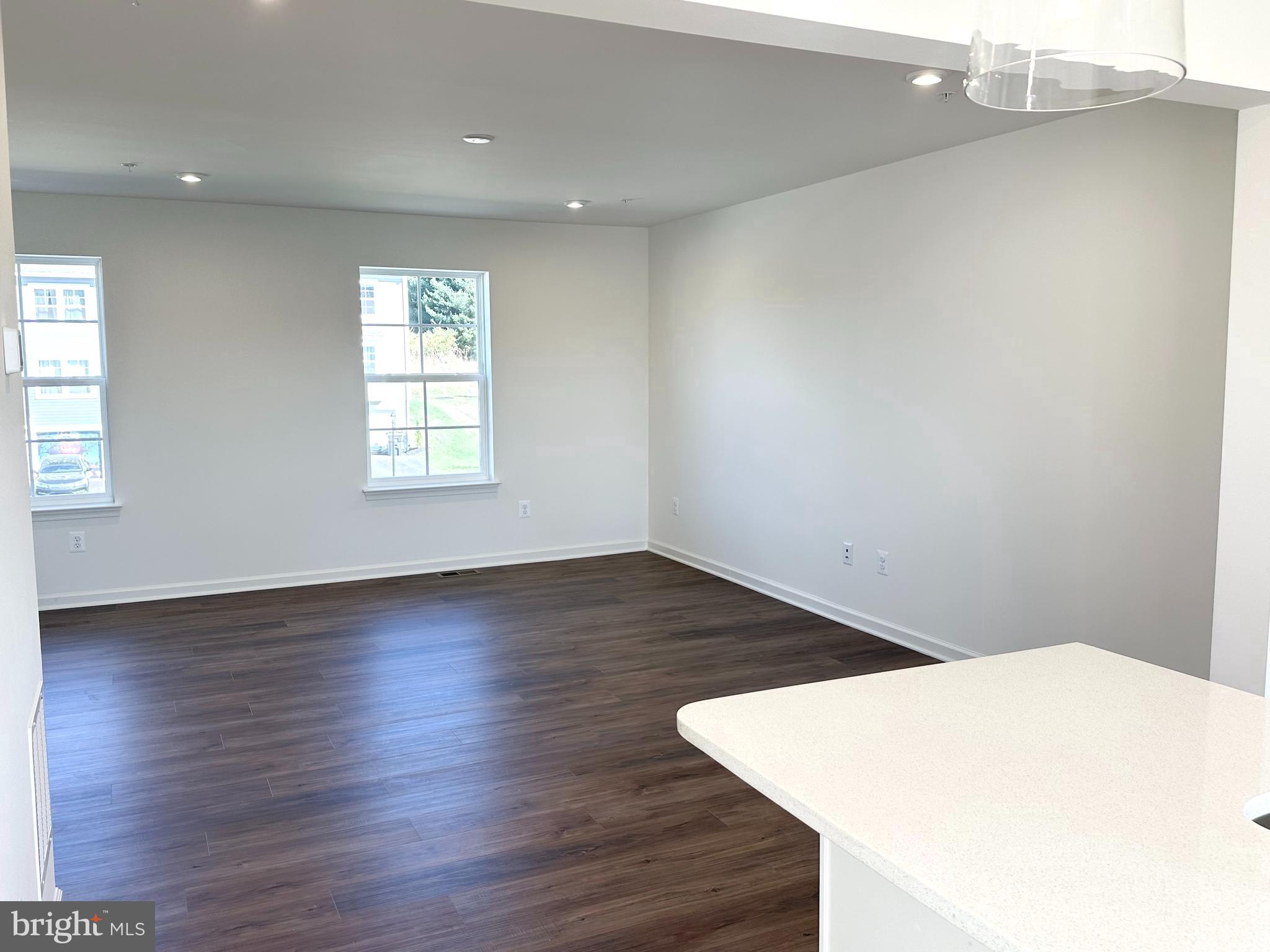 171 Homestead Drive Hanover, PA 17331 - Photo 10 of 34 an empty room with wooden floor and windows