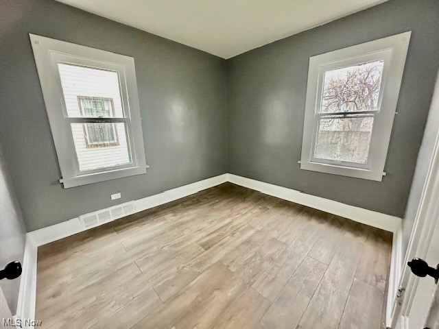 972 Paxton Road Cleveland, OH 44108 - Photo 14 of 22 Empty room with light hardwood / wood-style floors