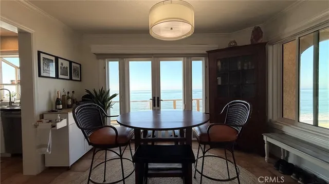 a kitchen with granite countertop a sink stove and cabinets