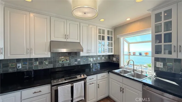 a spacious bathroom with a double vanity sink a mirror and a shower