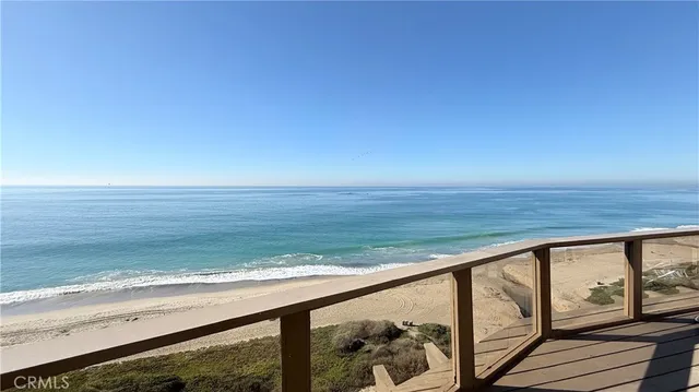 a garage with a white cabinets and stainless steel appliances