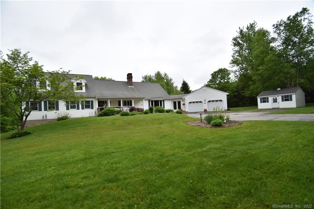 253 Slater Road Tolland, CT 06084 - Photo 1 of 1 a front view of a house with a garden