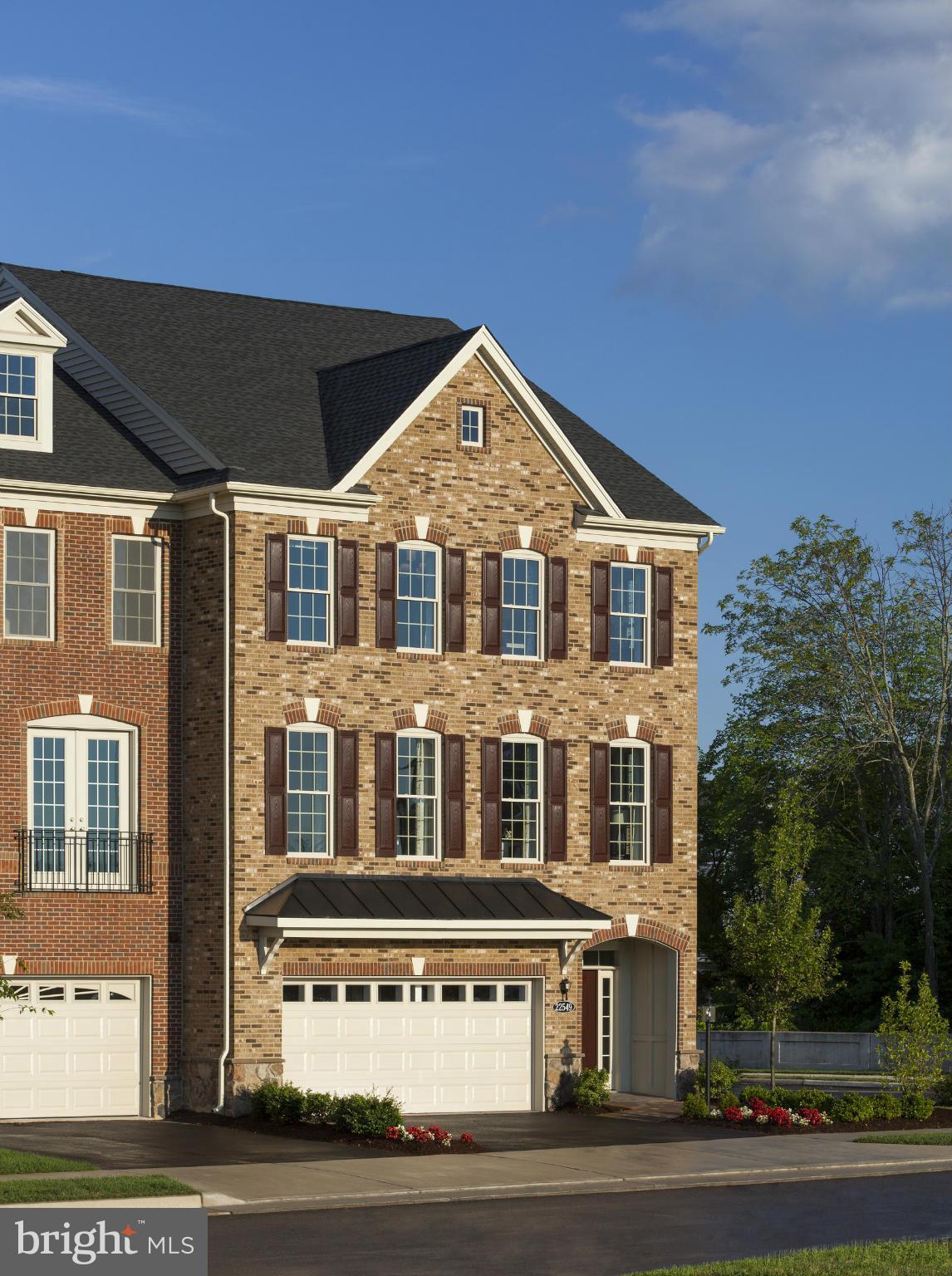 22595 Windsor Locks Square Ashburn, VA 20148 - Photo 1 of 13 a front view of residential houses with street
