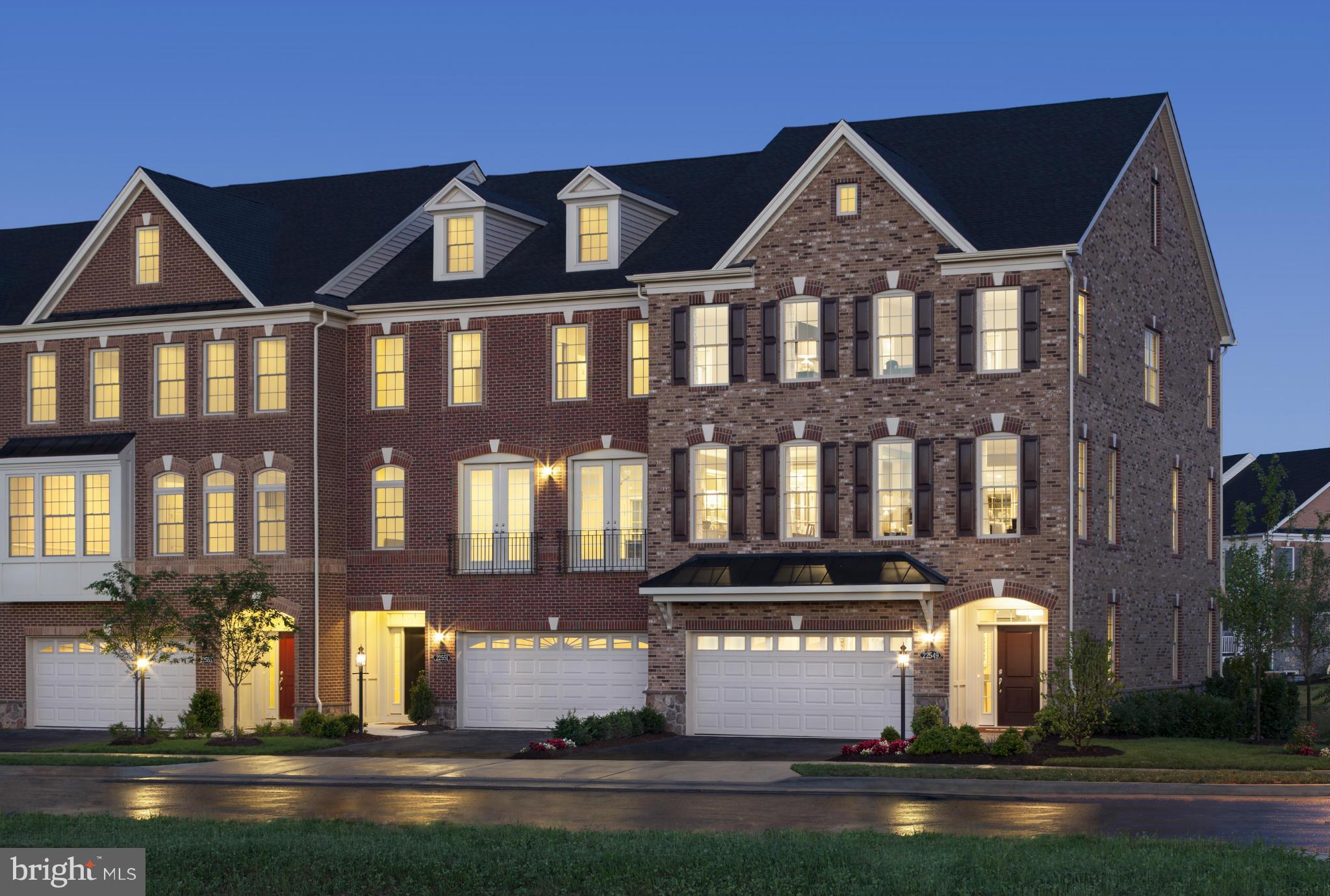 22595 Windsor Locks Square Ashburn, VA 20148 - Photo 2 of 13 a front view of a house with a yard