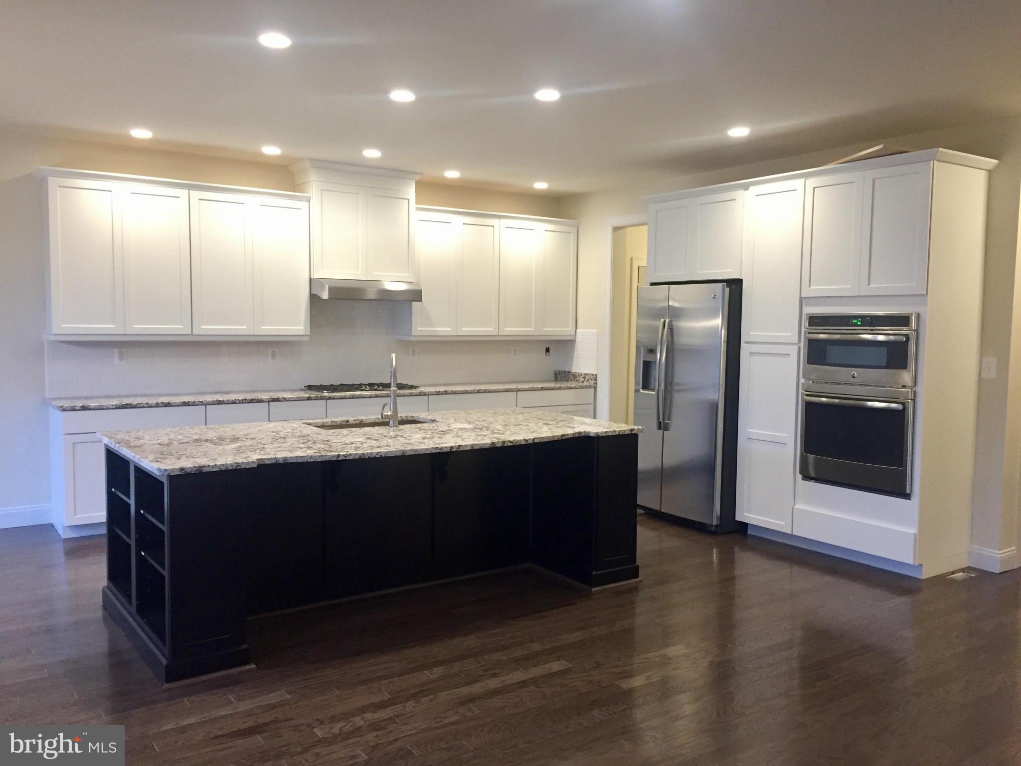 22595 Windsor Locks Square Ashburn, VA 20148 - Photo 4 of 13 a view of kitchen with stainless steel appliances sink refrigerator and microwave