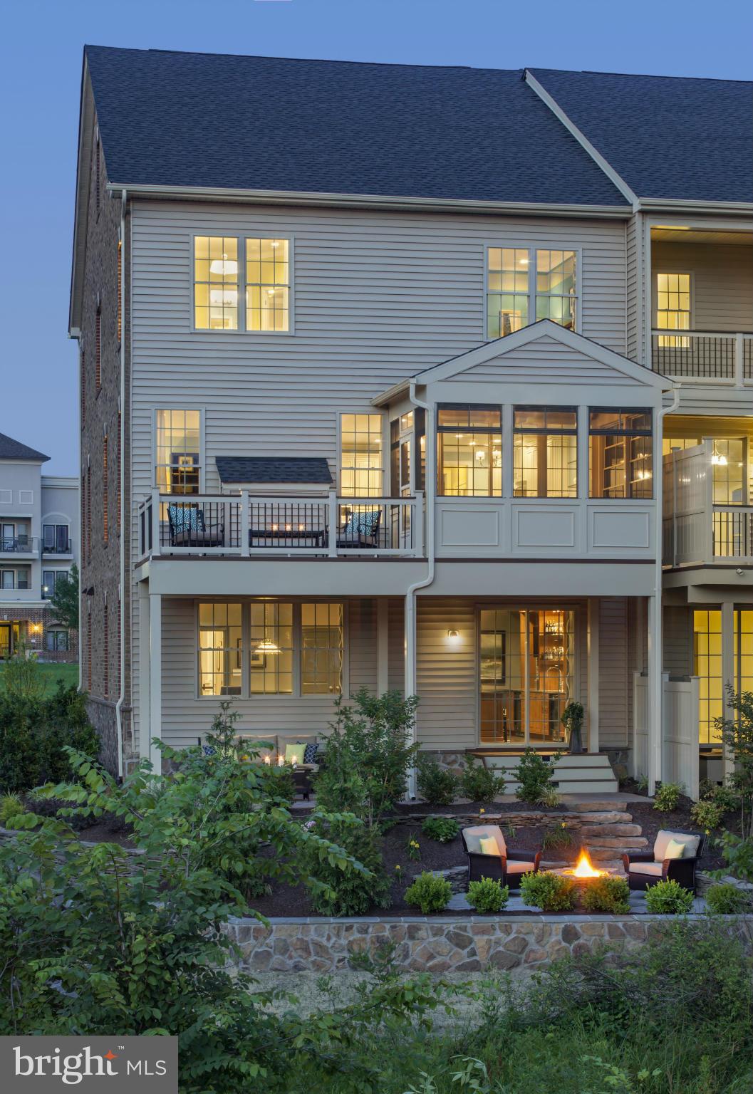 22595 Windsor Locks Square Ashburn, VA 20148 - Photo 7 of 13 a front view of a house with swimming pool and garden