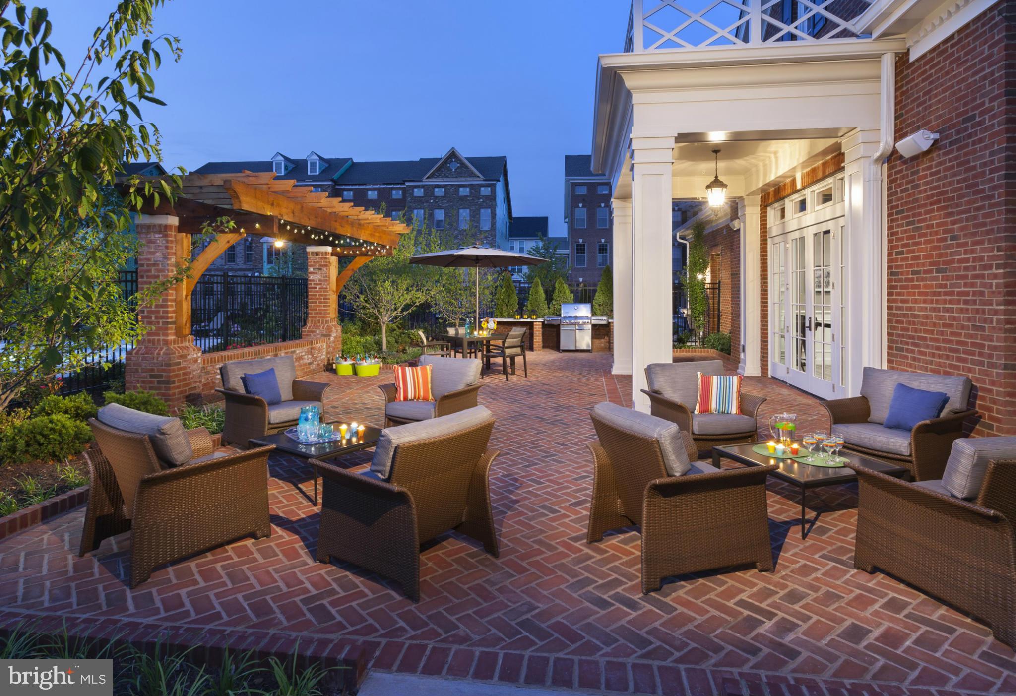 22595 Windsor Locks Square Ashburn, VA 20148 - Photo 10 of 13 a outdoor living space with furniture and a potted plant