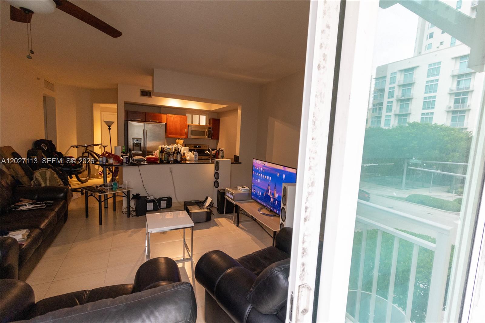 7275 Southwest 90th Way, Unit 213 Miami, FL 33156 - Photo 12 of 31 a room with furniture and a large window