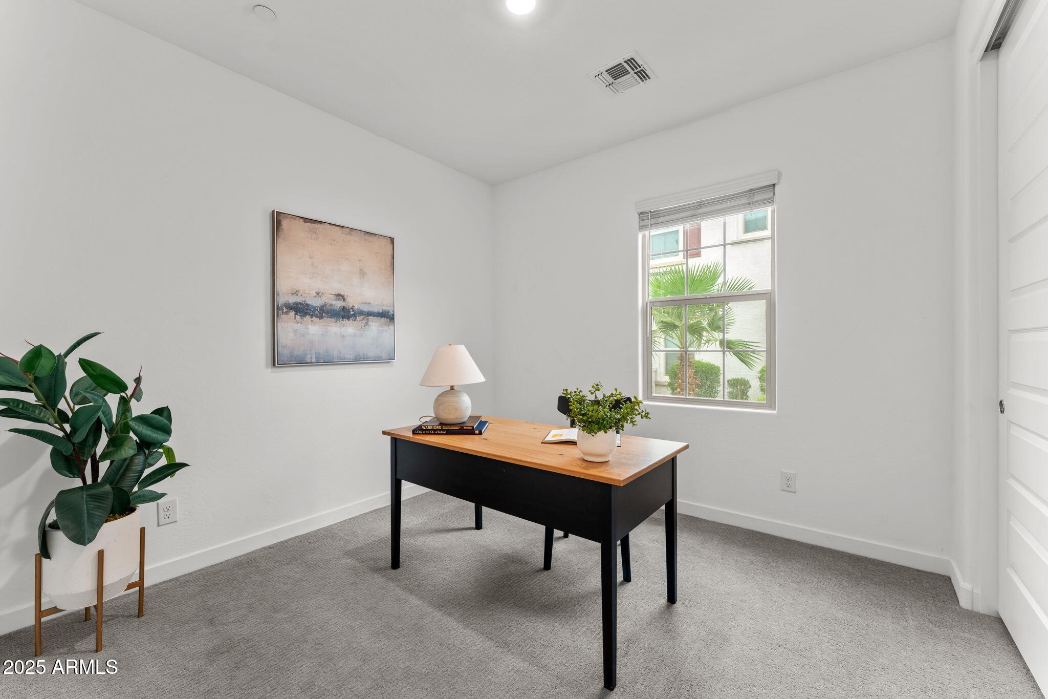 4077 South Sabrina Drive, Unit 127 Chandler, AZ 85248 - Photo 16 of 46 a workspace with furniture and a potted plant