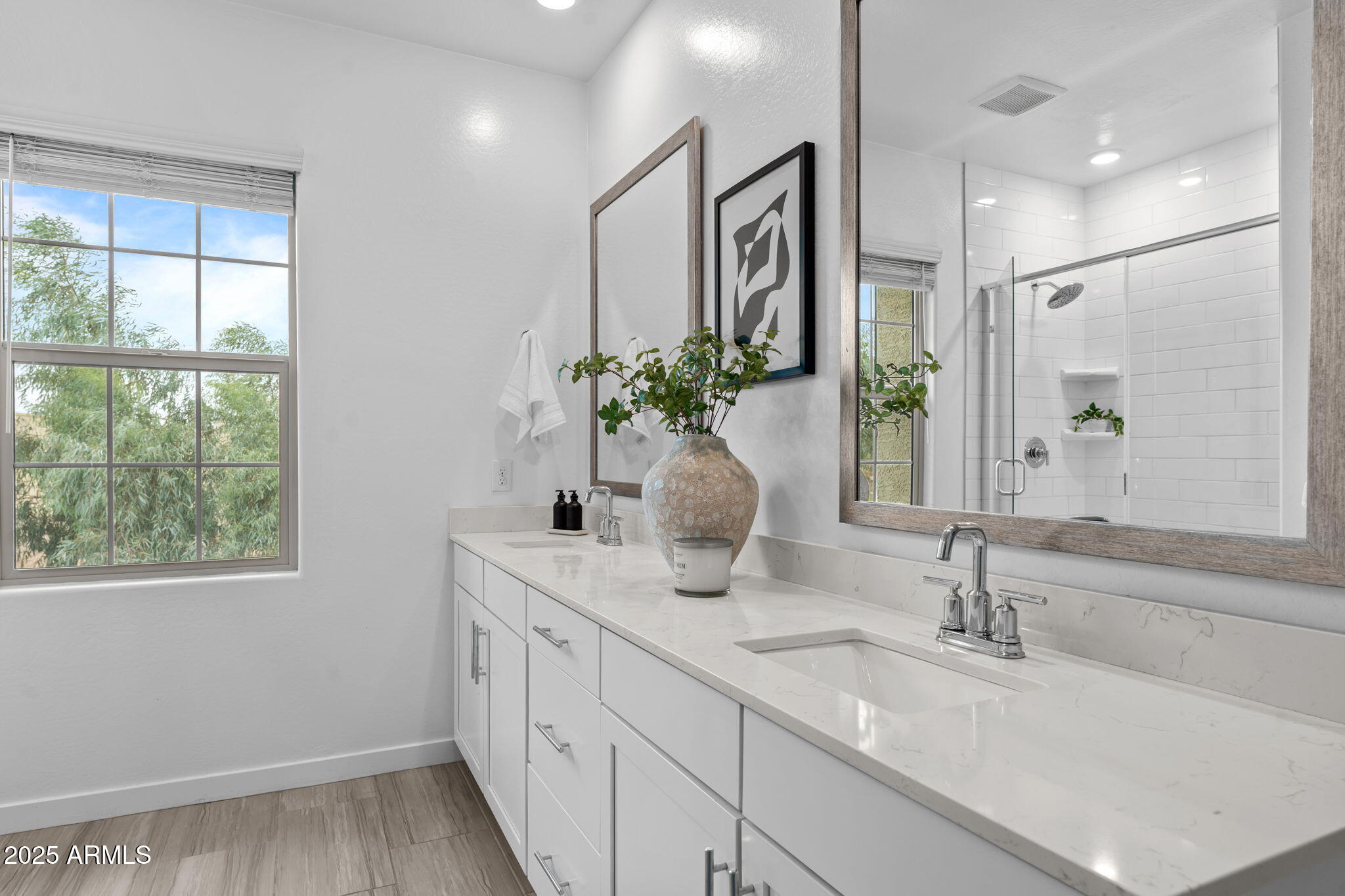 4077 South Sabrina Drive, Unit 127 Chandler, AZ 85248 - Photo 22 of 46 a bathroom with a double vanity sink and a mirror