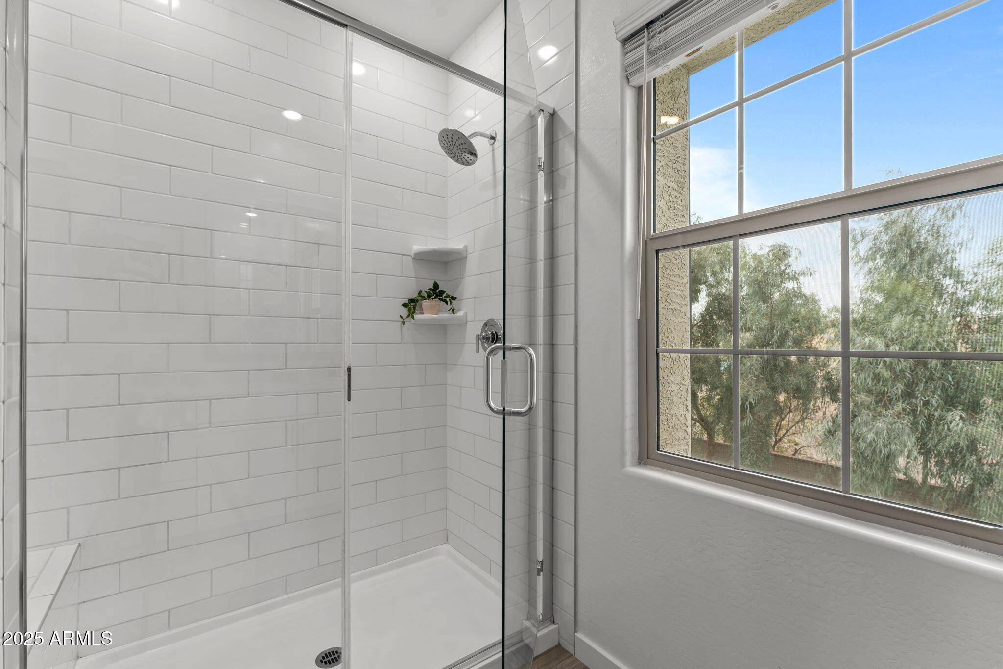 4077 South Sabrina Drive, Unit 127 Chandler, AZ 85248 - Photo 23 of 46 a bathroom with a glass shower door
