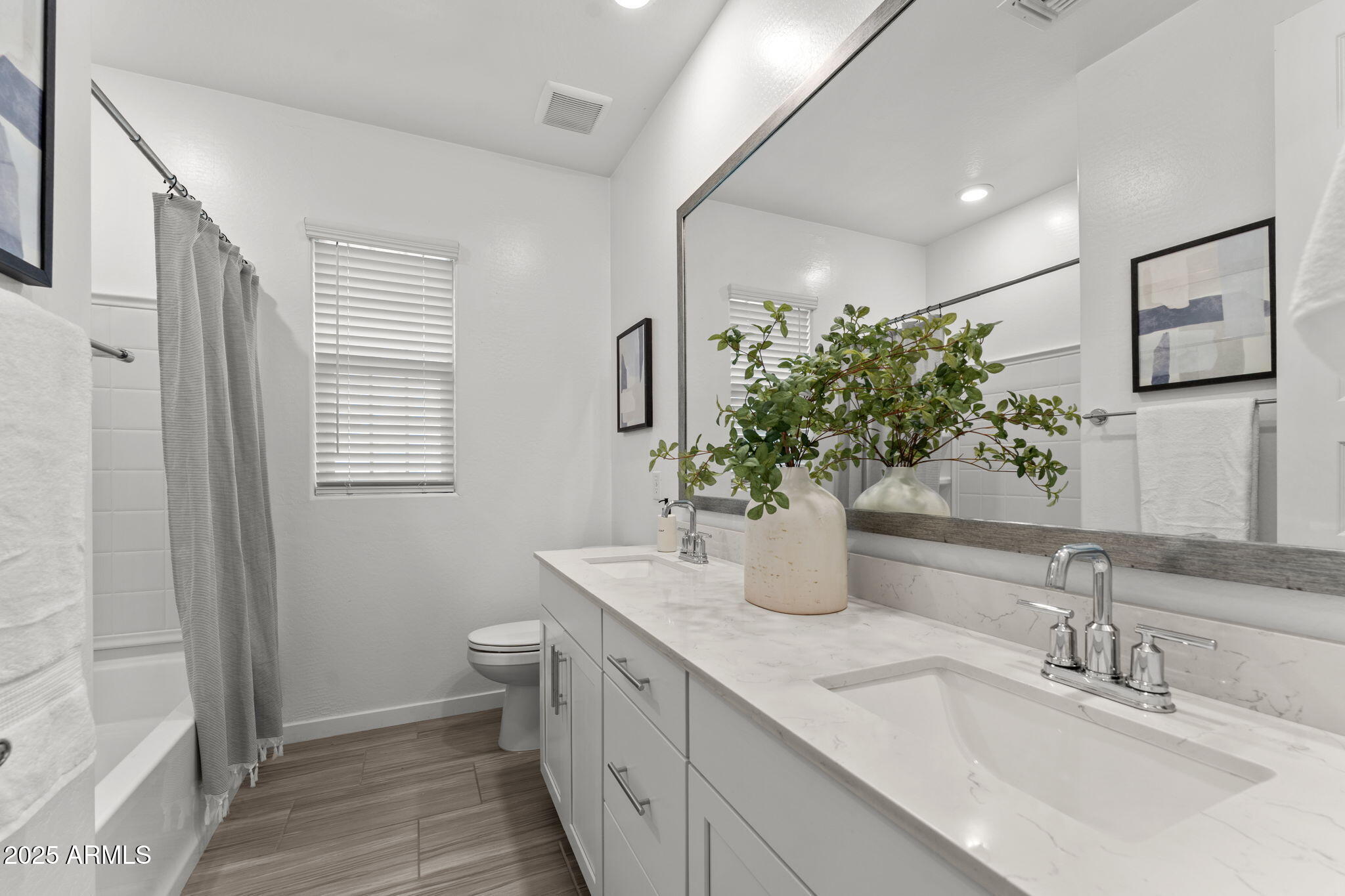 4077 South Sabrina Drive, Unit 127 Chandler, AZ 85248 - Photo 26 of 46 a bathroom with a granite countertop sink a toilet a large mirror and shower
