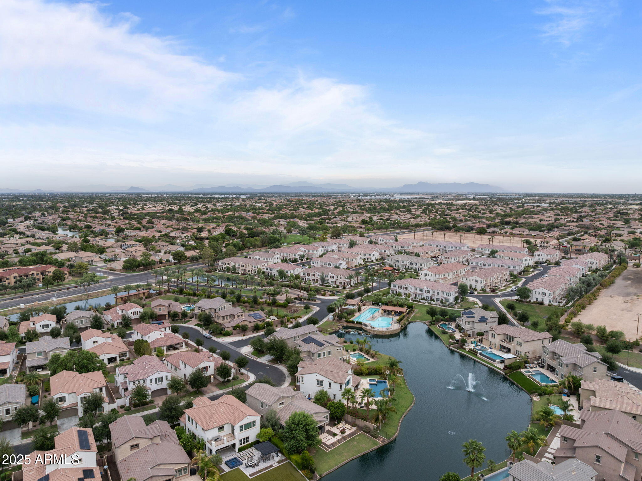 4077 South Sabrina Drive, Unit 127 Chandler, AZ 85248 - Photo 38 of 46 an aerial view of a city with lots of residential buildings