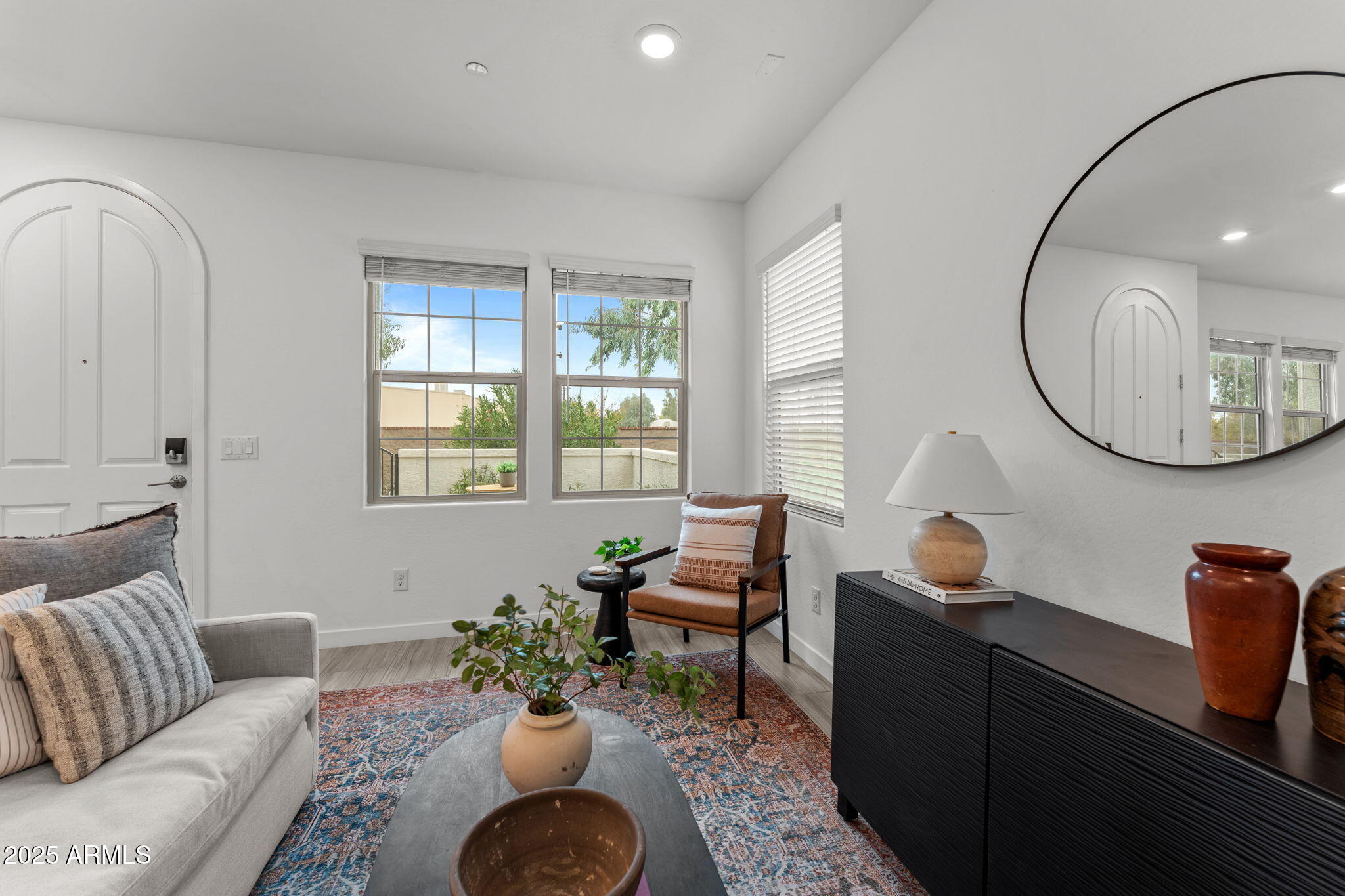 4077 South Sabrina Drive, Unit 127 Chandler, AZ 85248 - Photo 4 of 46 a living room with furniture and a mirror