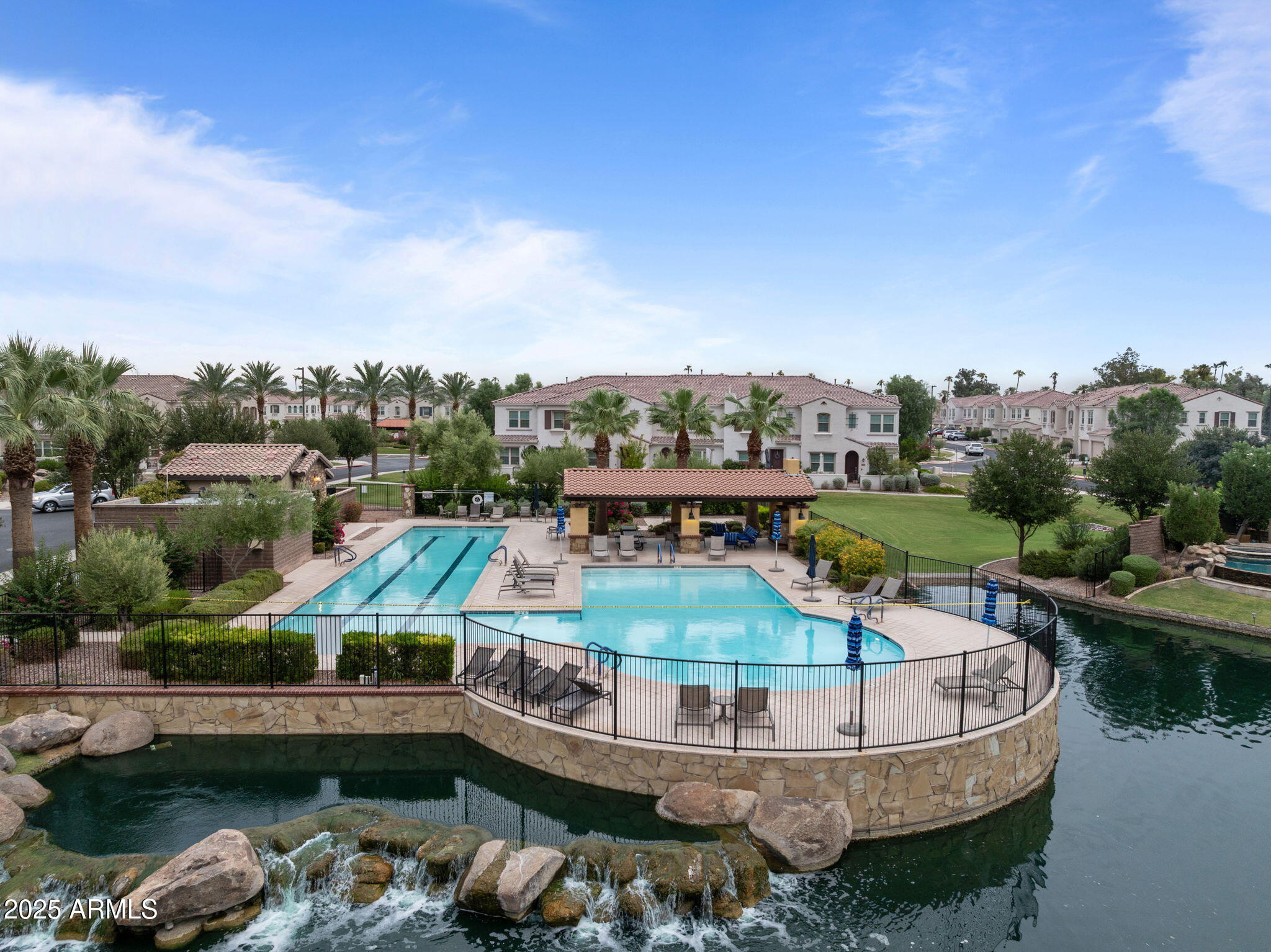4077 South Sabrina Drive, Unit 127 Chandler, AZ 85248 - Photo 45 of 46 a view of a lake with a house swimming pool and outdoor space