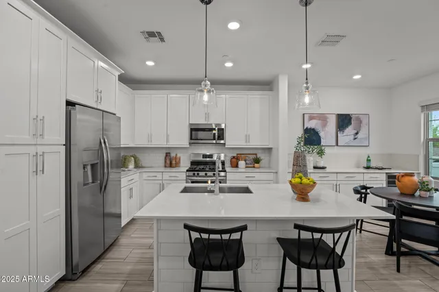 a living room with furniture a window and a lamp