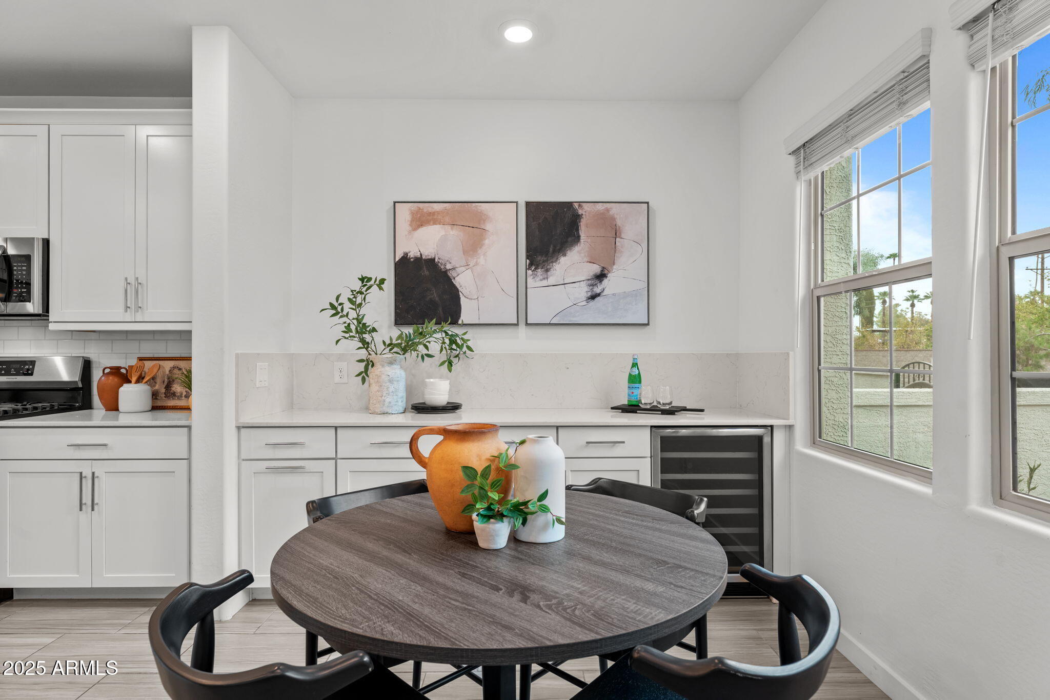 4077 South Sabrina Drive, Unit 127 Chandler, AZ 85248 - Photo 9 of 46 a view of a dining room with furniture window and wooden floor