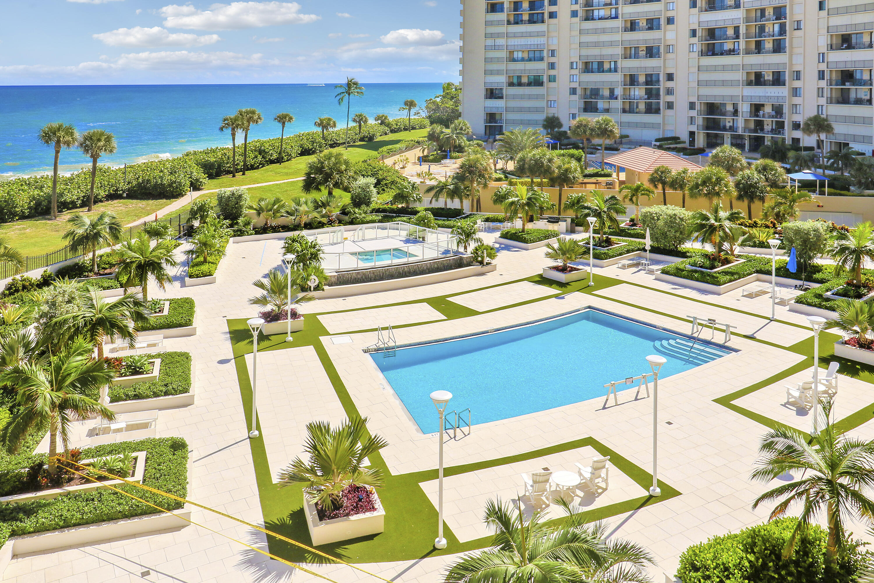 200 Ocean Trail Way, Unit 407 Jupiter, FL 33477 - Photo 20 of 22 a view of a swimming pool with outdoor seating