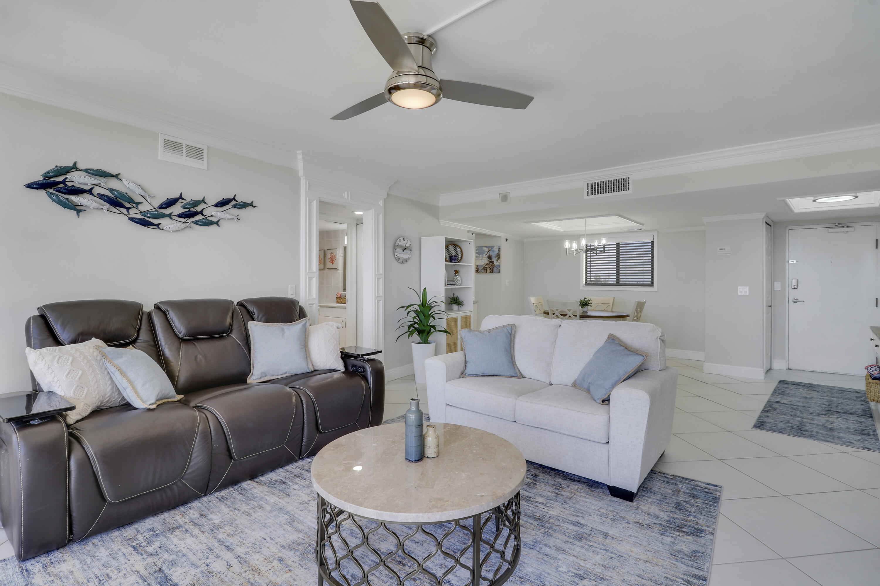 200 Ocean Trail Way, Unit 407 Jupiter, FL 33477 - Photo 5 of 22 a living room with furniture and a view of kitchen