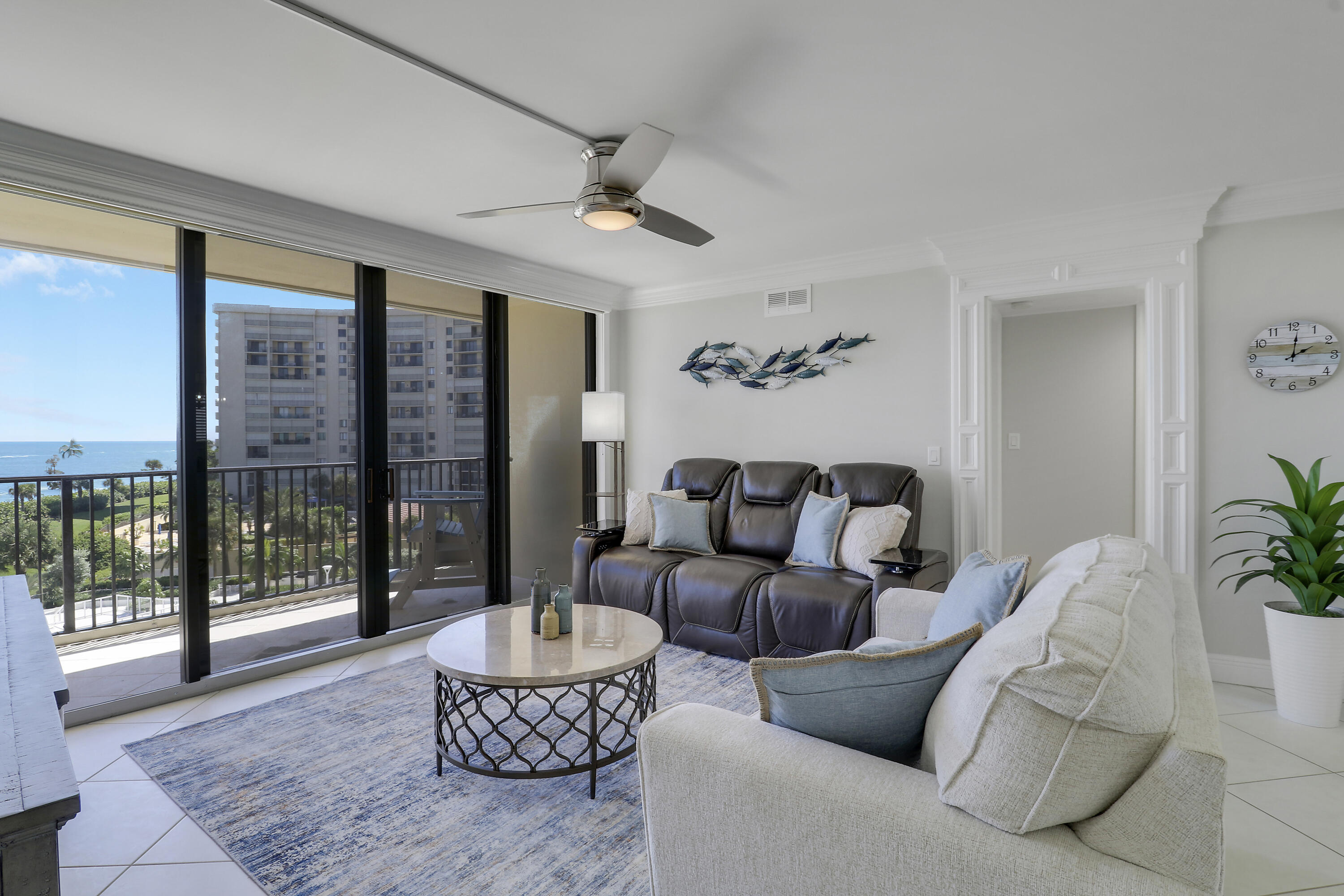 200 Ocean Trail Way, Unit 407 Jupiter, FL 33477 - Photo 8 of 22 a living room with furniture and a potted plant