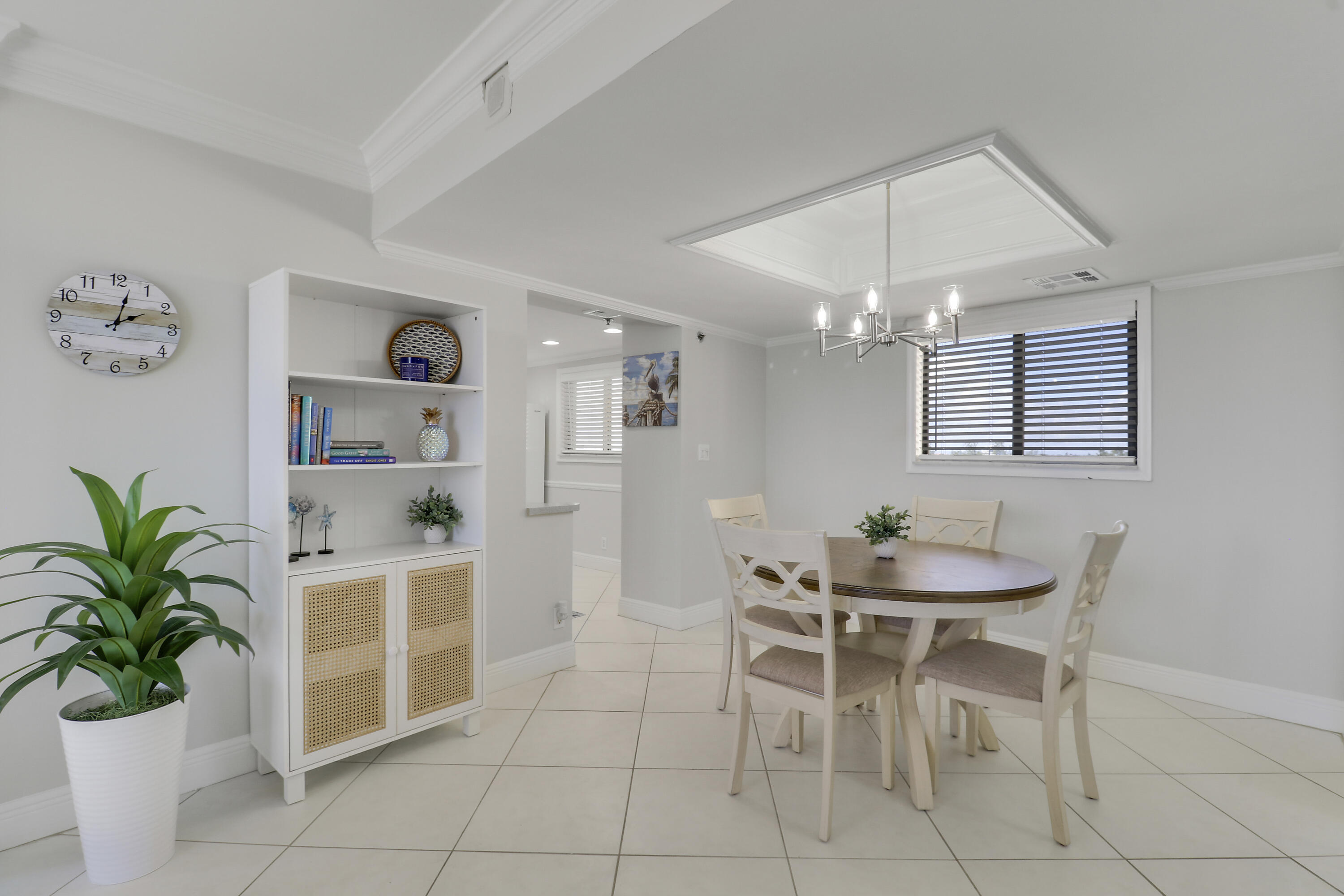 200 Ocean Trail Way, Unit 407 Jupiter, FL 33477 - Photo 10 of 22 a dining room with furniture and a potted plant