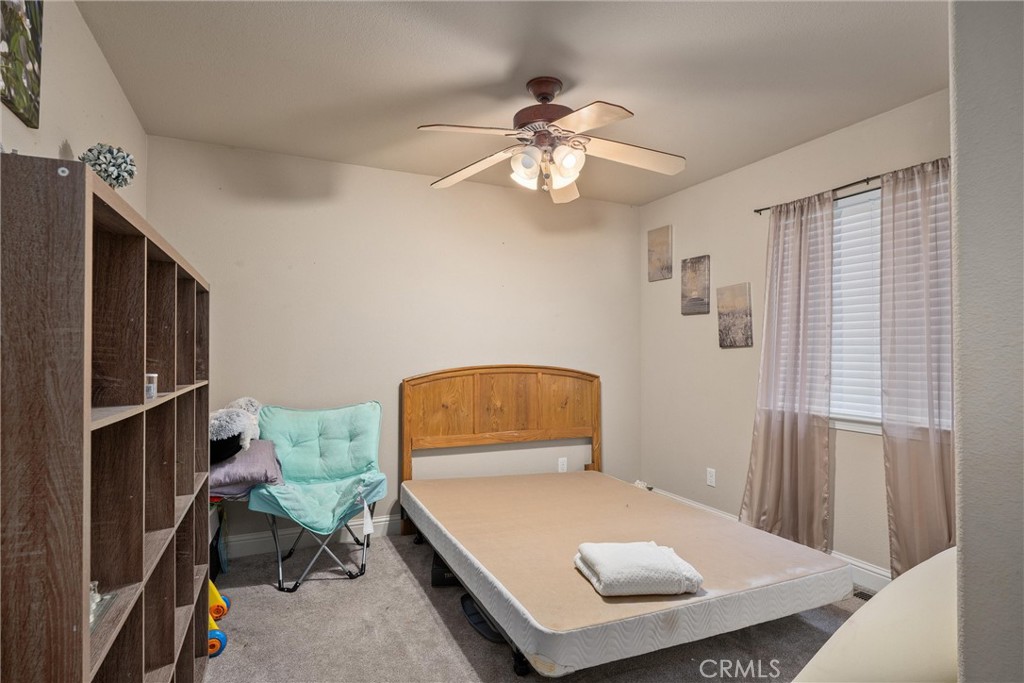 14689 Carnegie Road Magalia, CA 95954 - Photo 21 of 32 a room with furniture and window