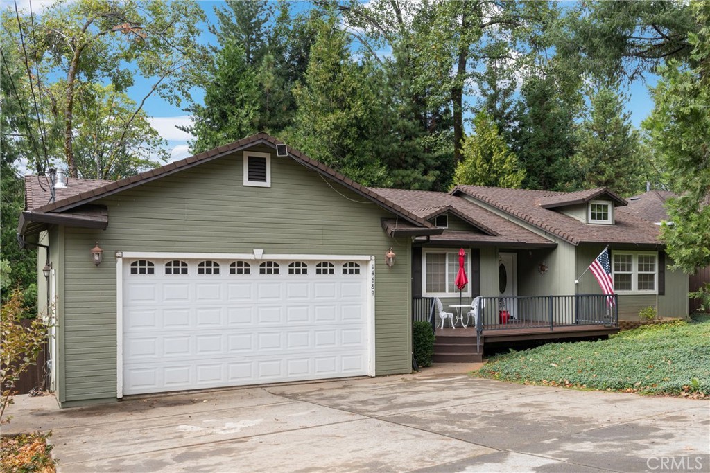 14689 Carnegie Road Magalia, CA 95954 - Photo 4 of 32 a house with trees in the background