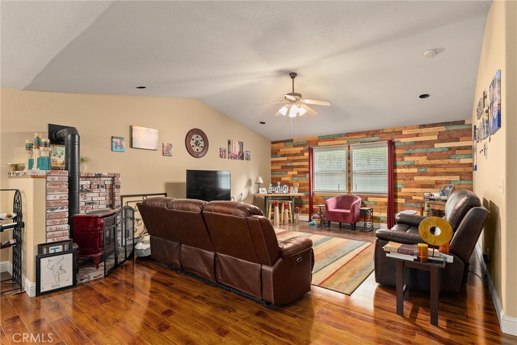 14689 Carnegie Road Magalia, CA 95954 - Photo 8 of 32 a living room with furniture and a fireplace