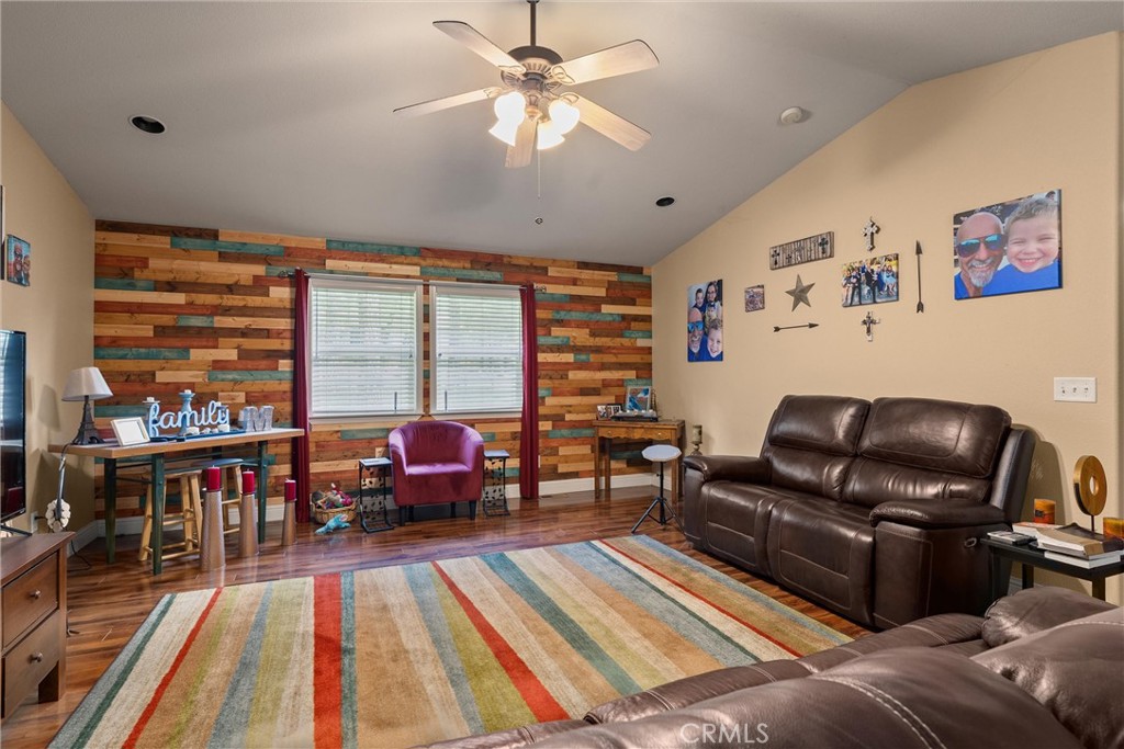 14689 Carnegie Road Magalia, CA 95954 - Photo 9 of 32 a living room with furniture and a floor to ceiling window