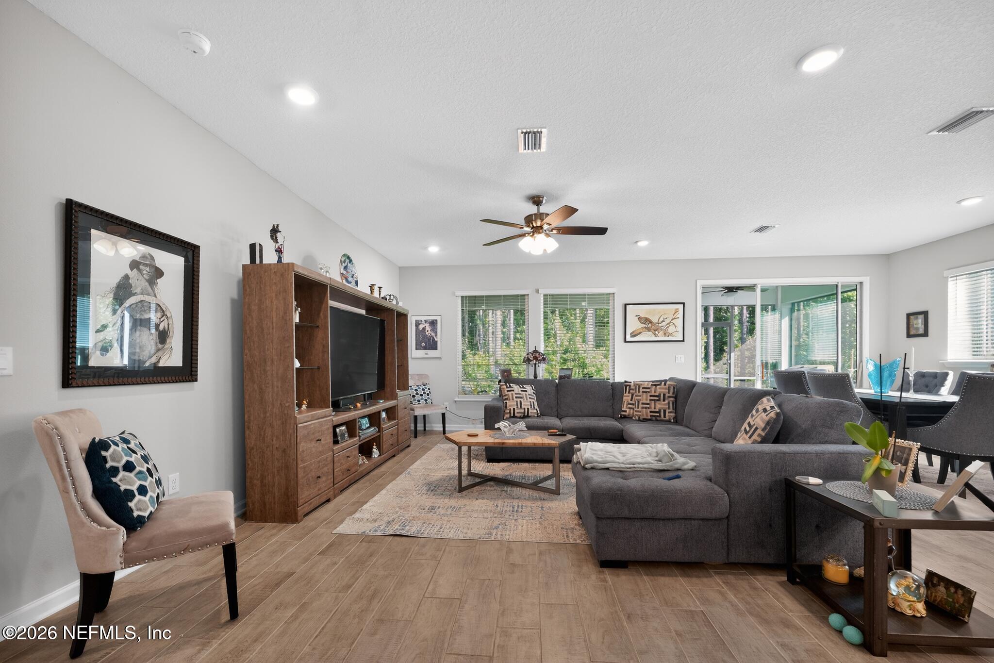 75505 Banyan Way Yulee, FL 32097 - Photo 9 of 30 a living room with furniture and a flat screen tv